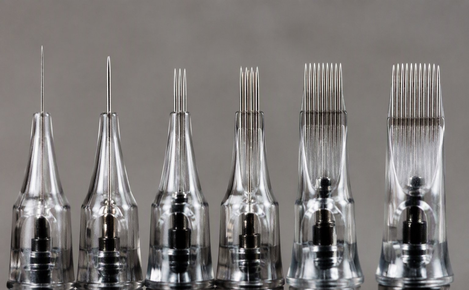Macro comparison of tattoo needle tips in different gauges and configurations