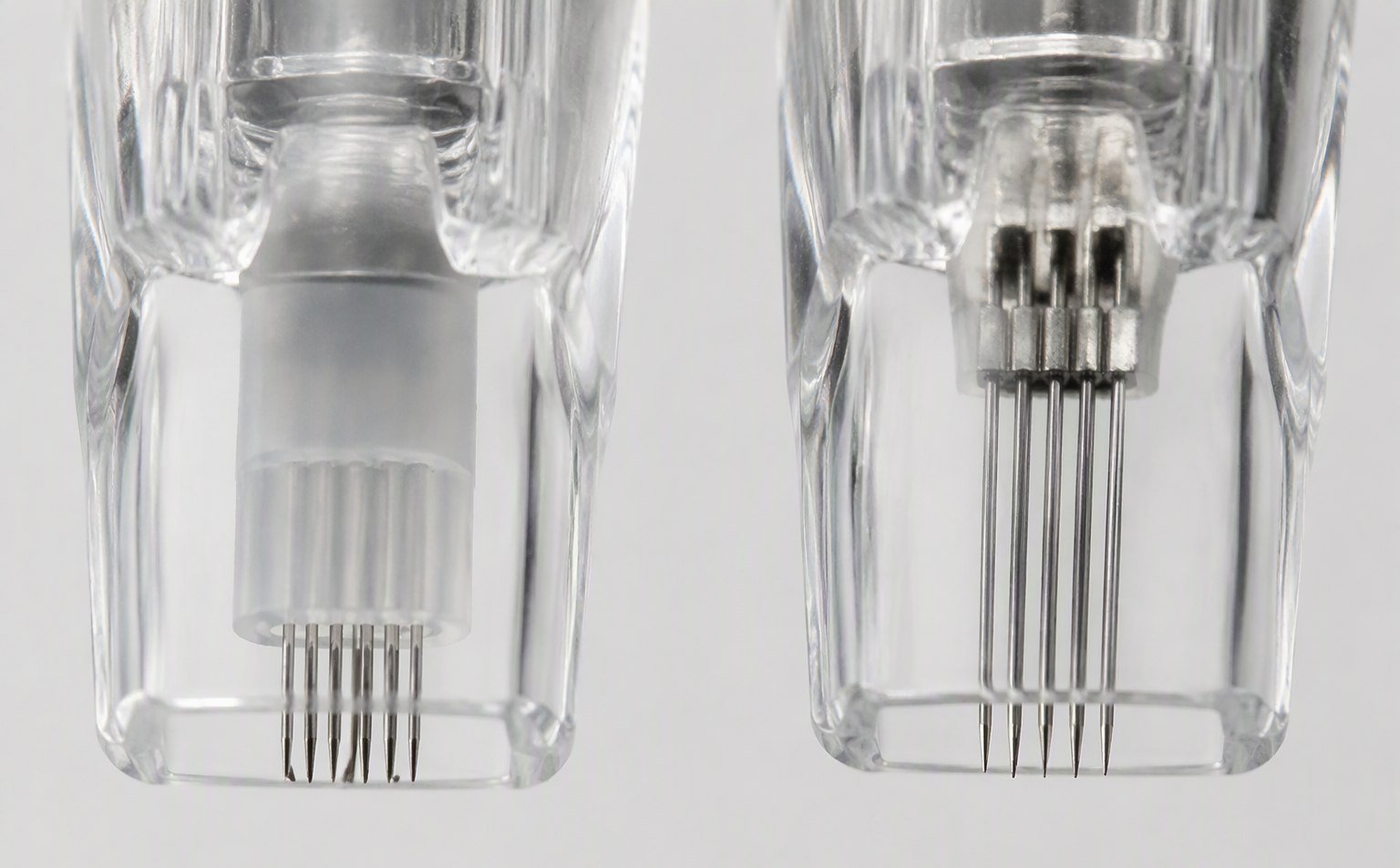 Needle bars with and without silicone wrapping inside transparent cartridges